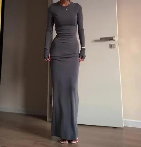 فساتين نسائية ربيع وخريف 2025 موضة جديدة مثيرة نحيفة تعانق الورك مريحة بلون سادة فستان طويل غير رسمي برقبة مستديرة