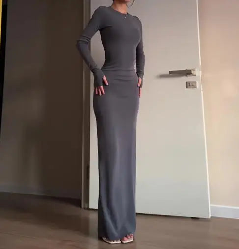 فساتين نسائية ربيع وخريف 2025 موضة جديدة مثيرة نحيفة تعانق الورك مريحة بلون سادة فستان طويل غير رسمي برقبة مستديرة