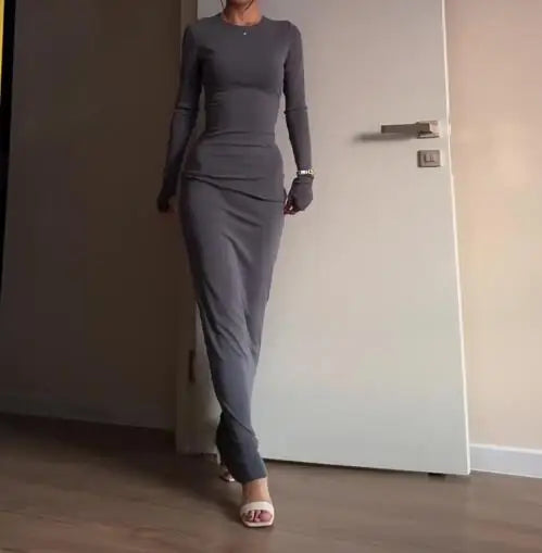 فساتين نسائية ربيع وخريف 2025 موضة جديدة مثيرة نحيفة تعانق الورك مريحة بلون سادة فستان طويل غير رسمي برقبة مستديرة